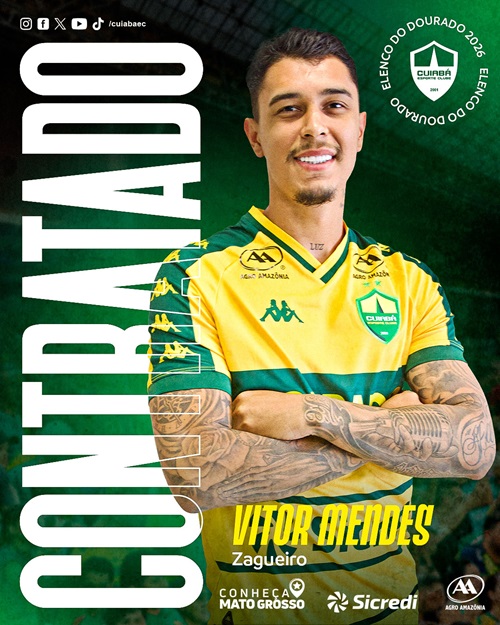 Arte gráfica de apresentação do zagueiro Vitor Mendes no Cuiabá. Ele aparece sorrindo com os braços cruzados, exibindo tatuagens detalhadas nos braços e a palavra "LUZ" tatuada no pescoço. Veste o uniforme amarelo e verde com os patrocinadores "Agro Amazônia" e "Sicredi". À esquerda, o texto "CONTRATADO" em letras grandes verticais e, abaixo, seu nome e a posição "Zagueiro". No canto superior, há um selo escrito "ELENCO DO DOURADO 2026".