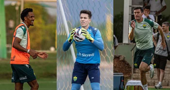 Montagem fotográfica (tríptico) de três jogadores do Cuiabá em campo. Da esquerda para a direita: O volante Lucas Mineiro sorrindo, vestindo colete laranja sobre a camisa de treino. No centro, o goleiro Luan Polli, de uniforme azul e luvas amarelas, segurando a bola. À direita, o zagueiro Nathan correndo, vestindo camisa de treino verde-clara e shorts verde-escuros.